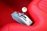 The modified seat is worth a closer look. You can really get an appreciation for a good upholstery guy when you see work like this. The B&M Pro Ratchet shifter is in perfect reach of the Mike Sr. so he can bang his way through the gears on the street or strip.  &raquo; Click to zoom ->