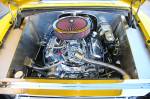 Going from top to bottom on the motor, we have a 750-cfm Summit carb bolted to an Edelbrock Air Gap intake that sits on a set of Vortec heads sporting 1.94/1.50 valves. Those valves are opened and closed by a roller cam of unknown specs and a set of hydraulic roller lifters. A stroker crank moves stock rods and hyper pistons. MSD is credited with the ignition system. The Vintage Air serpentine belt system is pretty slick as well. Afterburner headers carry the gasses away. It&rsquo;s all backed up by a Turbo 400 transmission with a 2300 stall converter.  &raquo; Click to zoom ->