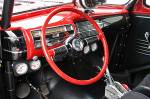 That's one hell of an expensive steering wheel. This is the correct wheel for the car and they are not growing on trees. The whole motif would have been for naught if a modern wheel were used. This one rules.  &raquo; Click to zoom ->