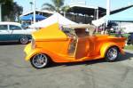 The photo can't do justice to the paint on this 34 Ford Roadster Pickup. The candy pearl Tangerine looked good enough to eat. I'm hungry. Where's the breakfast burrito vendor?  &raquo; Click to zoom ->