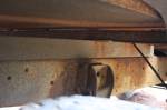 The bed is actually mounted on top of a couple of four by four posts laid on top of the fram rails. This was done to provide the clearance needed to get over the big tires.  &raquo; Click to zoom ->