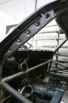 Our favorite style points on the F-Bomb are the punch-plates linking the cage to the A-pillars. A matching panel replaces the factory plastic under the dash.  &raquo; Click to zoom ->
