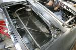 In the trunk, the downbars tie into the parachute yank bar that&rsquo;s located right where the license plate attaches.  &raquo; Click to zoom ->
