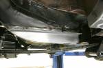 The rear framerails had to be notched extensively to clear the leaf springs after the leaves were moved inboard.  &raquo; Click to zoom ->