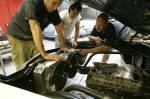 Tom, Scott, and Larry from Nelson Supercars are checking out the fit of our super-trick, custom-made, dual-pass radiator from Ron Davis (http://www.rondavisradiators.com). This is one of the best features of the car, since it stays cool in virtually any kind of traffic and heat.  &raquo; Click to zoom ->