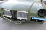 Ron Davis also made the twin air-to-air intercoolers that sit ahead of the radiator. Note that all the stock hood hardware is still in place.  &raquo; Click to zoom ->