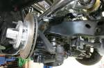 The front suspension uses Moroso coils, QA1 shocks, Global West arms, and 2-inch drop spindles. All four corners have Wilwood brakes with vented rotors.  &raquo; Click to zoom ->