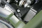 Set into custom paneling in the engine compartment are Earl&rsquo;s coolers for the engine and trans. Adding fans to the passenger-side trans cooler dropped the trans temps by 40 degrees.  &raquo; Click to zoom ->