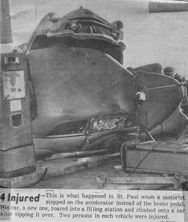 Antique car wreck at gas station