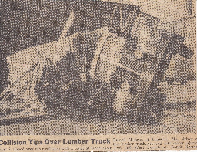 Lumber truck on side