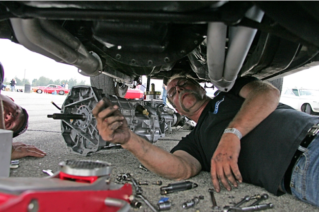 Walt Reynolds thrashing on his Camaro