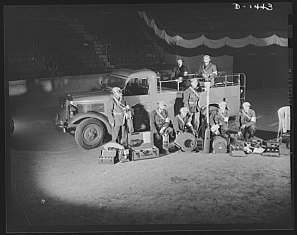 A well equipped civil service crew and truck A well equipped civil service crew and truck