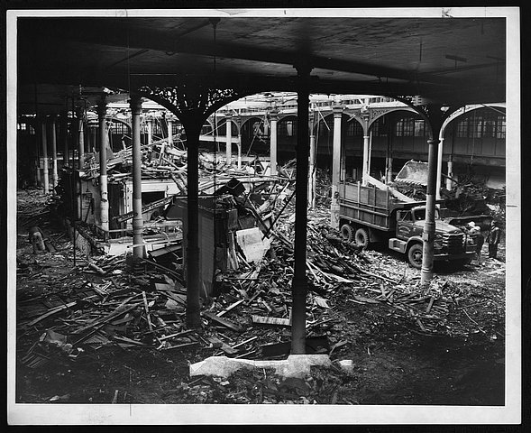 Building wreckers hard at work Building wreckers hard at work