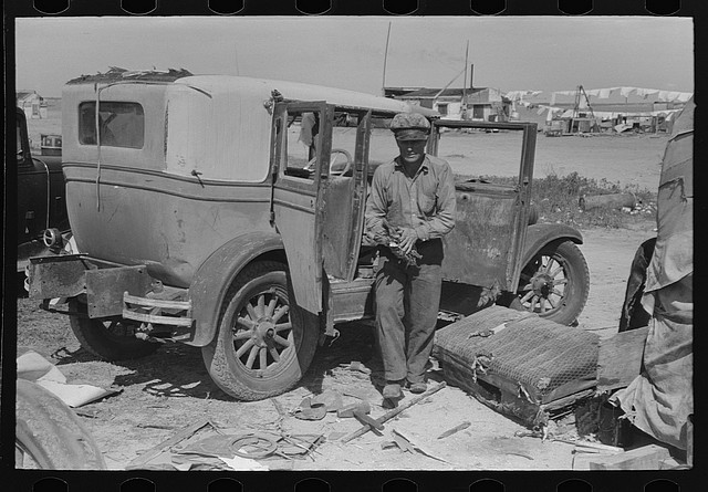 A junkyard man hard at work A junkyard man hard at work